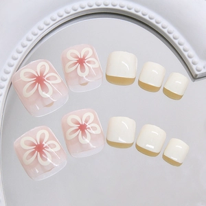 Cute cream flower press-on toenails set with pink gradient and white floral designs
