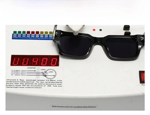 UV400 protection test showing black square sunglasses on a UV radiation detector device
