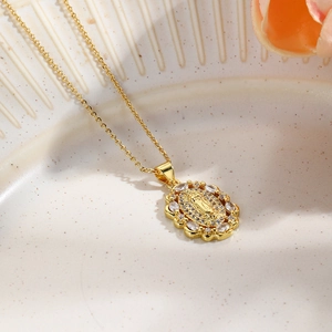 Gold plated oval pendant necklace with Virgin Mary relief and sparkling cubic zirconia stones