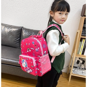 Pink unicorn kids backpack side view showing mesh water bottle pocket and padded straps