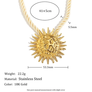 Detail shot of 18K gold sun shell pendant necklace with size specs and measurements