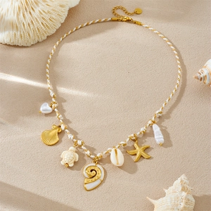 Braided rope necklace with gold starfish, turtle, seashell and pearl charms
