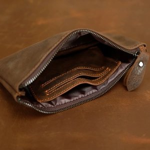 Detail of crazy horse leather wallet with removable card holder and zip closure