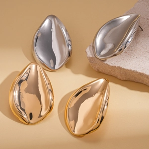Polished gold and silver irregular water drop stud earrings on stone props