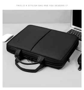 Top view of a black nylon laptop briefcase with reinforced handles and metal hardware