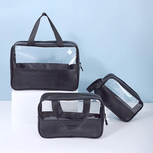 Three-piece set of black waterproof travel toiletry bags with clear PVC windows and sturdy handles