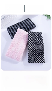Three long exfoliating washcloths in pink, striped, and honeycomb texture with hooks