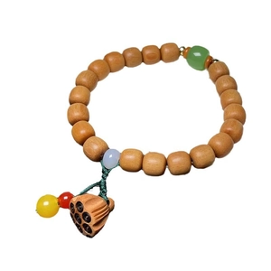 Bamboo-style sandalwood bracelet with lotus pod pendant and decorative jade-like beads