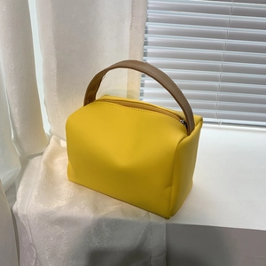 Minimalist yellow PU leather square handbag with brown handle and zipper closure