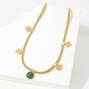 Gold snake chain necklace with green aventurine pendant and four-leaf clover charms