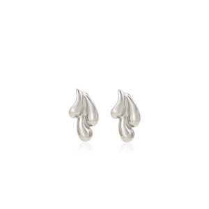Close-up of abstract silver liquid-metal earrings with layered teardrop-shaped details