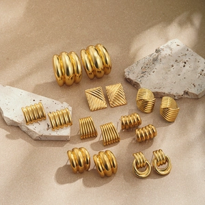 Collection of minimalist 18K gold-plated earrings with twisted and striped textures