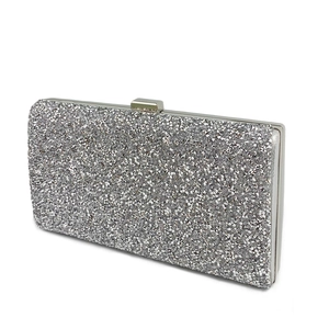 Detail of silver evening clutch bag with sparkling rhinestones and metal closure