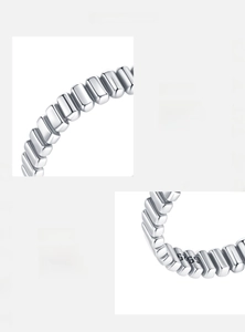 Detailed macro view showing S925 hallmark on minimalist silver beaded ring band
