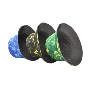 Patterned reversible bucket hat in black blue and green cotton canvas for outdoor sun protection