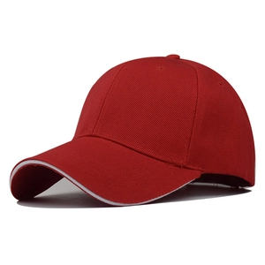 Detail of red polyester baseball cap featuring white sandwich peak and breathable eyelets