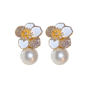 Elegant flower earrings with white enamel petals, zircon accents and hanging pearls