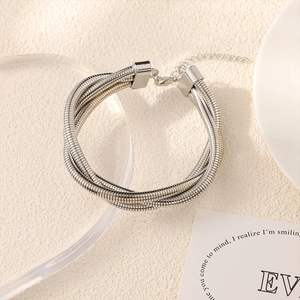 Close-up of multi-strand silver snake chain bracelet with adjustable lobster clasp