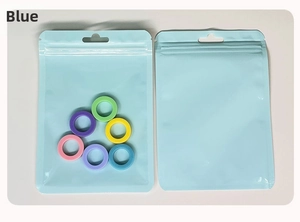 Close-up of translucent blue frosted zipper seal bag for colorful silicone ring storage