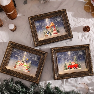Vintage bronze Christmas picture frame lantern with LED glowing winter scenes and snow