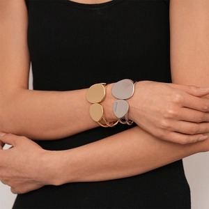 Minimalist double-layer irregular geometric open cuff bracelet in polished gold and silver