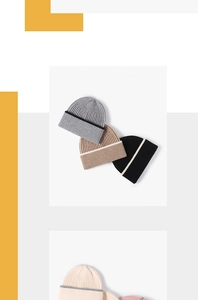 Close-up of ribbed knit beanies in multiple colors with contrast stripe detailing