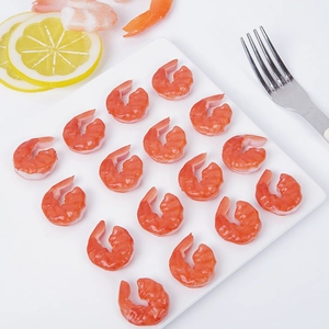 Set of realistic PVC shrimp models on a white plate with lemon slice for food display