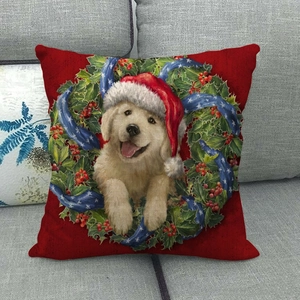 Housse de coussin de Noël avec chiot Golden Retriever et couronne sur fond rouge vif