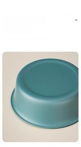 Close-up of bicolor washbasin edge showing premium matte texture and dark green finish