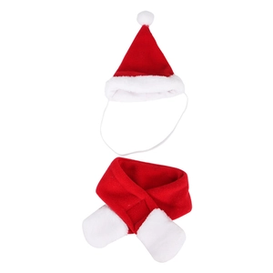 Detail of red and white plush Christmas pet hat and scarf set with elastic strap
