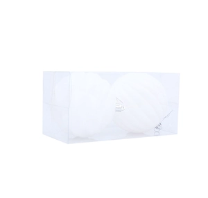 Close-up of two white spiral texture Christmas balls in transparent plastic box packaging