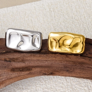 Detailed macro shot of 304 stainless steel rings in gold and silver hammered textures