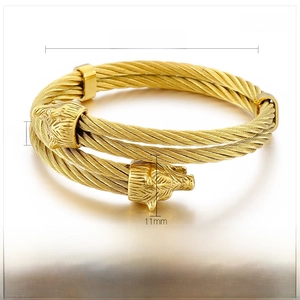 Detail view of gold double wolf head steel wire bracelet with specific size dimensions