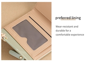 Detail view of the beige interior lining and card slots of this green leather wallet