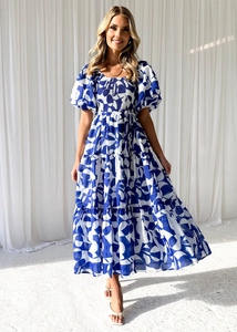 Detailed view of puff sleeves and layered skirt on floral off-shoulder maxi dress
