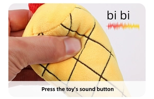 Detail of hand squeezing a yellow plush pet snuffle toy with built-in squeaker sound feature