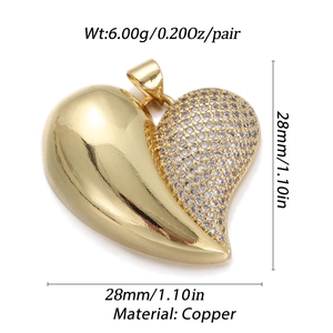 Macro shot of an 18K gold-plated heart pendant with cubic zirconia and smooth metal finish
