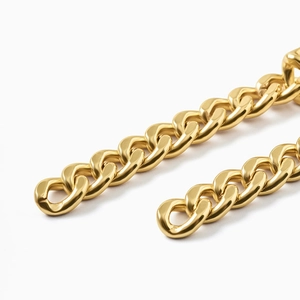 Macro detail of thick golden Cuban link metal chain with polished high-shine finish