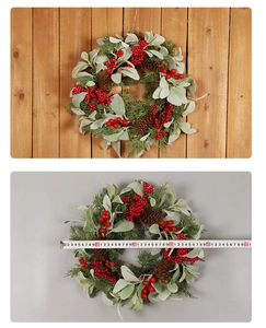 Close-up of a 45-50cm Christmas wreath with red berries, pine cones and green pine leaves