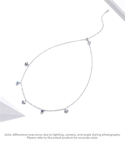 Detailed shot of S925 sterling silver ocean necklace with shells and colorful zircon gems