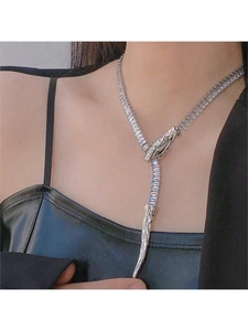 Close-up of adjustable silver snake necklace with sparkling rhinestones on model