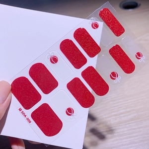 Détail d'autocollants ongles Noël SDA-009 avec paillettes rouges et nœuds blancs