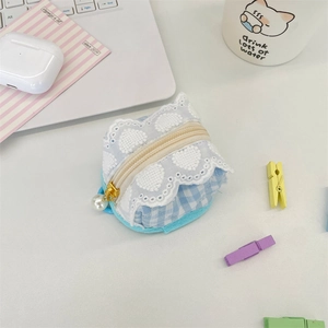 Close-up of blue gingham earphones pouch with white lace trim and pearl zipper pull