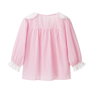 Detail view of pink and white checkered blouse featuring delicate lace collar and back pleats