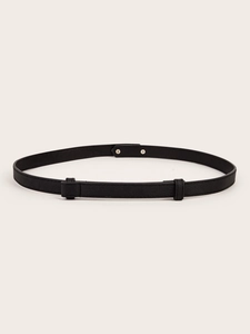 Detail of black Saffiano leather belt featuring a snap-button closure and twin loops