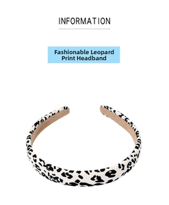 Detail of black and white leopard print headband with soft light brown inner lining