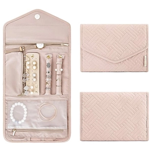 Pink quilted jewelry organizer roll with compartments for rings earrings and necklaces