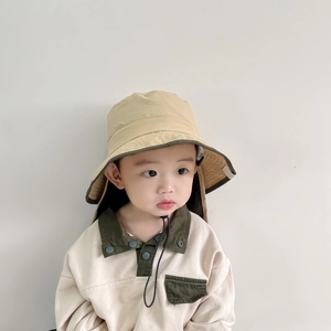 Detail of children's sun hat with neck protection flap and adjustable windproof cord