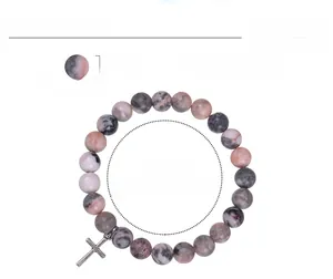 Detail view of 8mm pink zebra stone beads and cross charm with size specifications