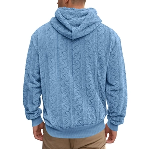 Macro detail of sky blue teddy fleece fabric and thick cable knit texture on hoodie back